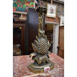 A cast brass pineapple doorstop, 33cm high.