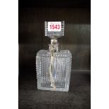 A silver mounted cut glass decanter and locking stopper, 19cm high, (s.d.