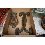 A pair of classical style brass handles; together with an Art Nouveau brass door knocker.