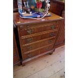 A reproduction yew wood dressing chest, 61cm wide.