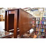 A vintage teak gateleg dining table, 89.5cm wide.