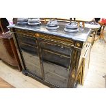 A late Victorian ebonized and inlaid side cabinet, 112cm wide.