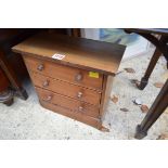 An old mahogany miniature three drawer chest, 32.5cm wide.