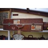 A Pendragon vintage brown leather suitcase