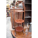 A circa 1920 mahogany three tier folding cake stand.