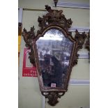 A pair of 18th century carved giltwood pier mirrors, 72 x 45cm, (losses).