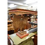 A carved gilt wood and scarlet painted eagle console table, 87.5cm wide.