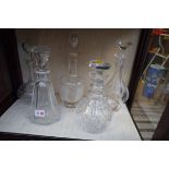 Nine 19th century and later cut glass glass decanters and stoppers;