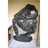 A New Zealand carved stone figural group, 39.5cm high.