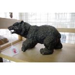 A bronze bear, 25cm long.