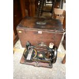 An antique German sewing machine, in wood box.