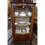 An Edwardian mahogany and line inlaid serpentine fronted display cabinet, 69.5cm wide.