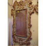 A pair of green painted and parcel gilt wall mirrors, in the Renaissance style, 80 x 43cm.