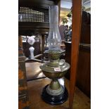 A Victorian brass oil lamp, height excluding chimney 32cm.