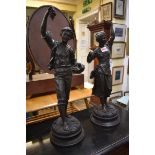 A pair of bronzed spelter figures, emblematic of summer, 53cm high.