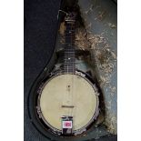 An F D H Ltd four string banjolele, cased.