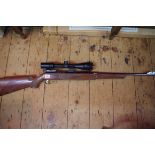 An old air rifle, with sight.