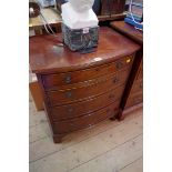 A reproduction small mahogany bowfront chest of drawers., 58.5cm wide.