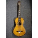 An antique six string small acoustic guitar, inscribed 'Keith, Prowse & Co, Manufacturers,