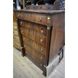 A French Empire mahogany chest of drawers, 101cm wide, (with later oak top).