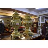 A pair of cast brass vases and covers, 33.5cm high.