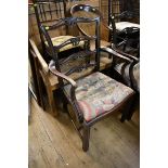 Two similar pairs of Georgian style mahogany elbow dining chairs.