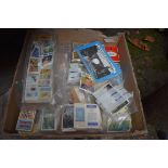 A collection of cigarette cards, tea cards, postcards and similar.