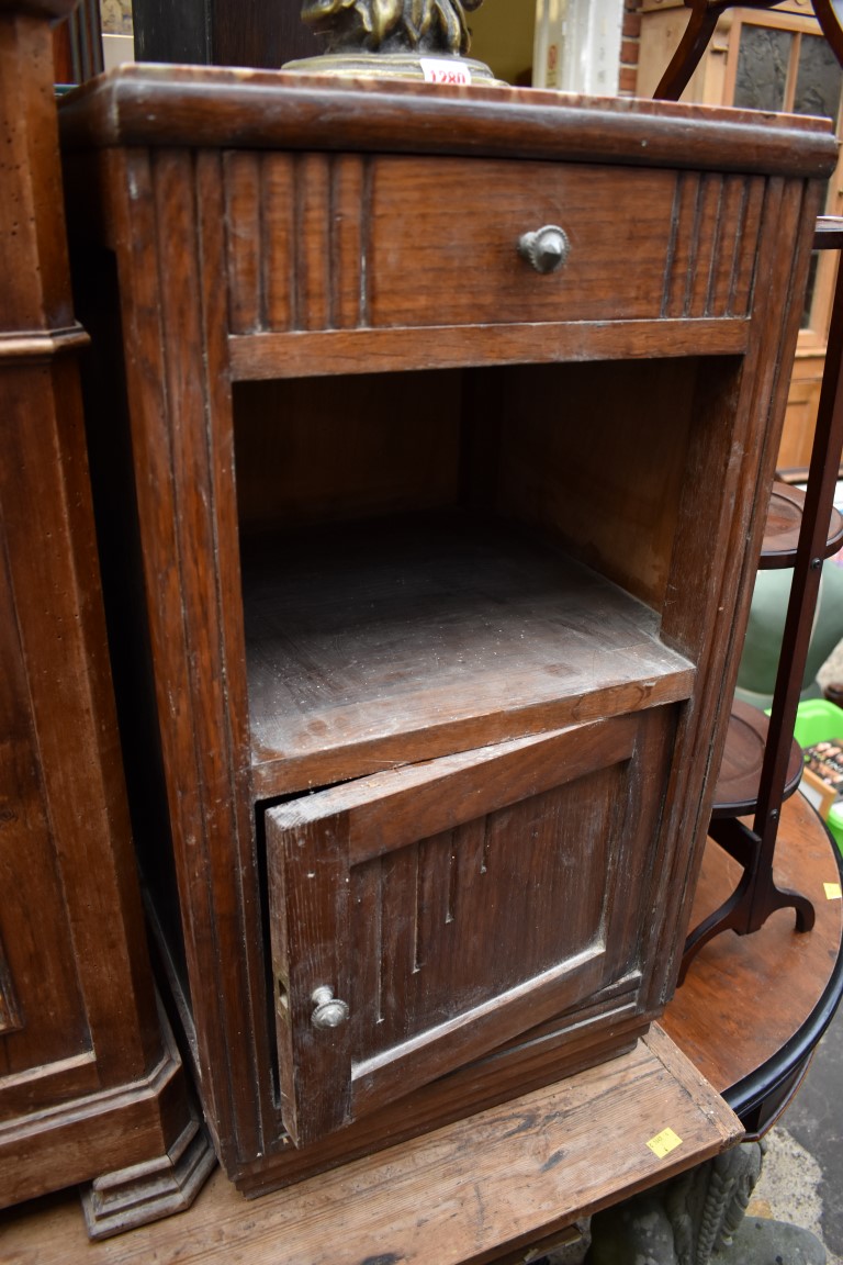 A 1930s oak and marble top pot cupboard.
