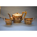 A Victorian silver bachelor's teaset, by Atkins Bros, Sheffield 1894/1895, having part reeded body,