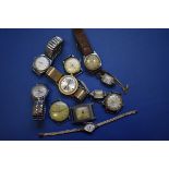 A quantity of gentleman's and ladies wristwatches,