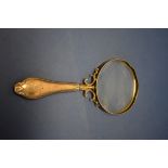 An Edwardian silver handled magnifying glass, maker indistinct, Birmingham 1902.