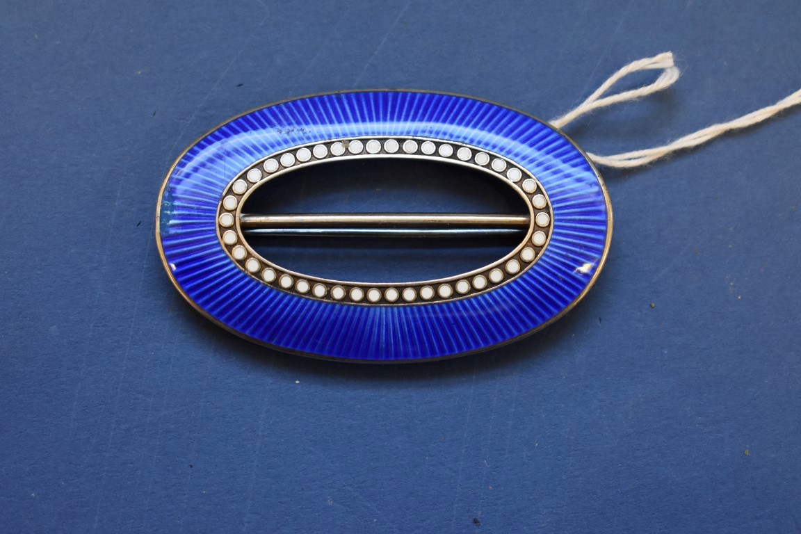 An early 20th century Norwegian .930 gilt, oval blue guilloche enamel buckle, by Marius Hammer, 6.