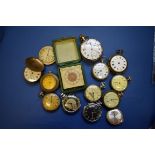 A quantity of pocket watches and a travelling clock.