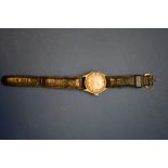 A World War II era ATP military wristwatch, by Bravingtons, on leather strap.