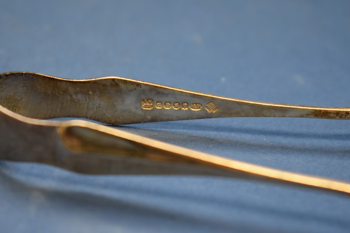 Five pairs of silver sugar tongs; together with two plated examples; - Image 5 of 5