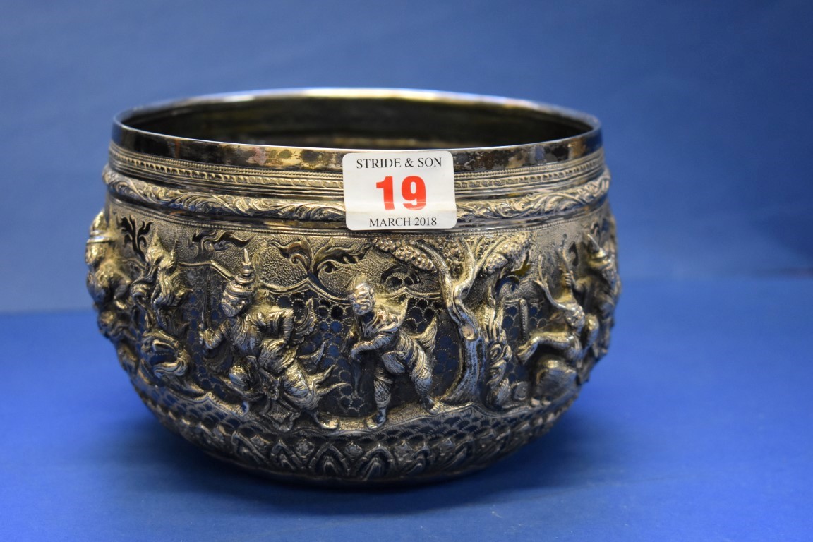 A Burmese white metal bowl, decorated temple dancers, 15cm diameter.