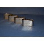 A set of four silver elliptical napkin rings, by D.