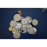 A quantity of watch dials.