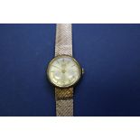 A vintage Tudor Royal 9ct gold ladies mechanical wristwatch, on a 9ct gold mesh bracelet.