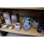 A small collection of Poole and Gouda pottery.