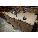 A 1920s bleached mahogany breakfront sideboard, 151.5cm wide.