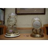 A Schatz 1000 day clock; together with another 400 day clock, each with glass dome,