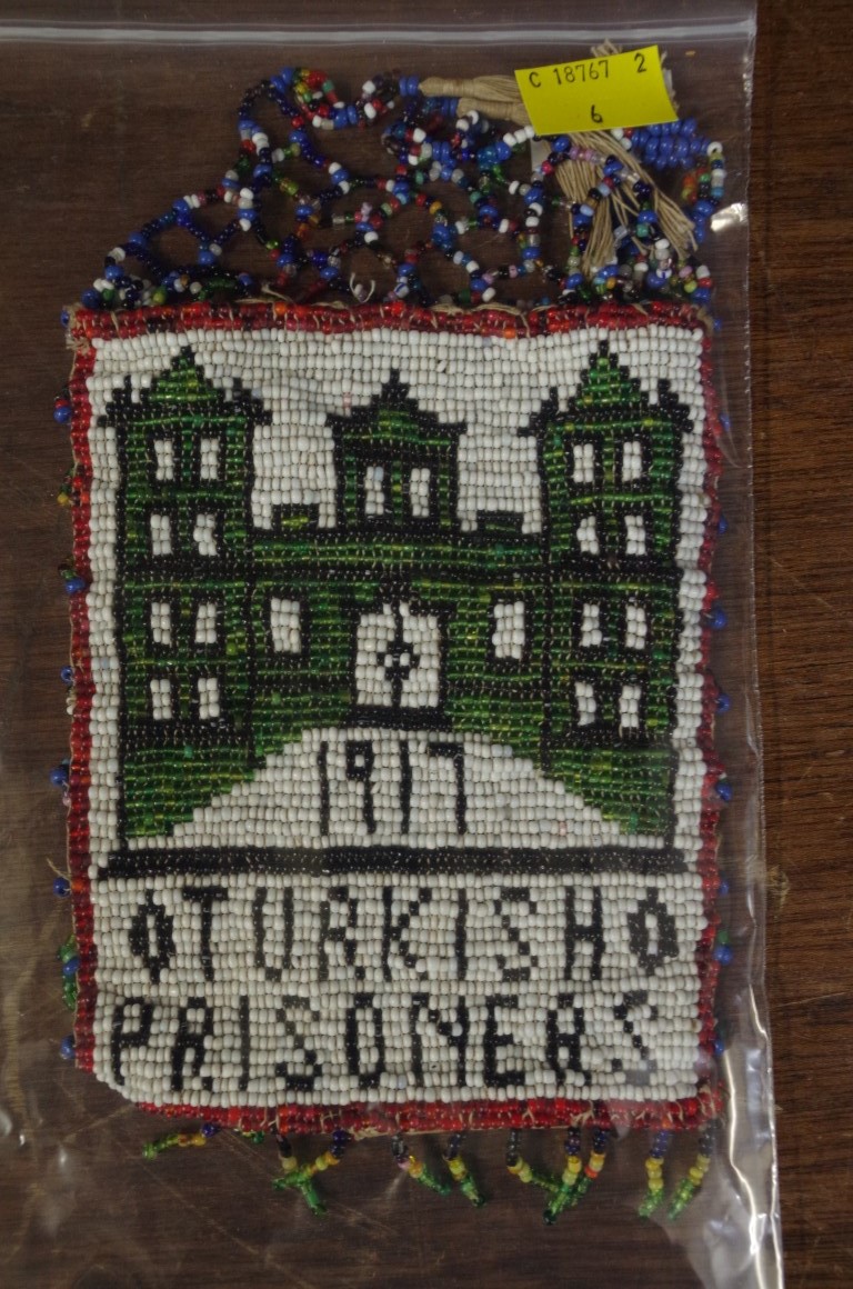 A rare 1917 'Turkish Prisoners' beadwork bag, the panel 14 x 11cm.