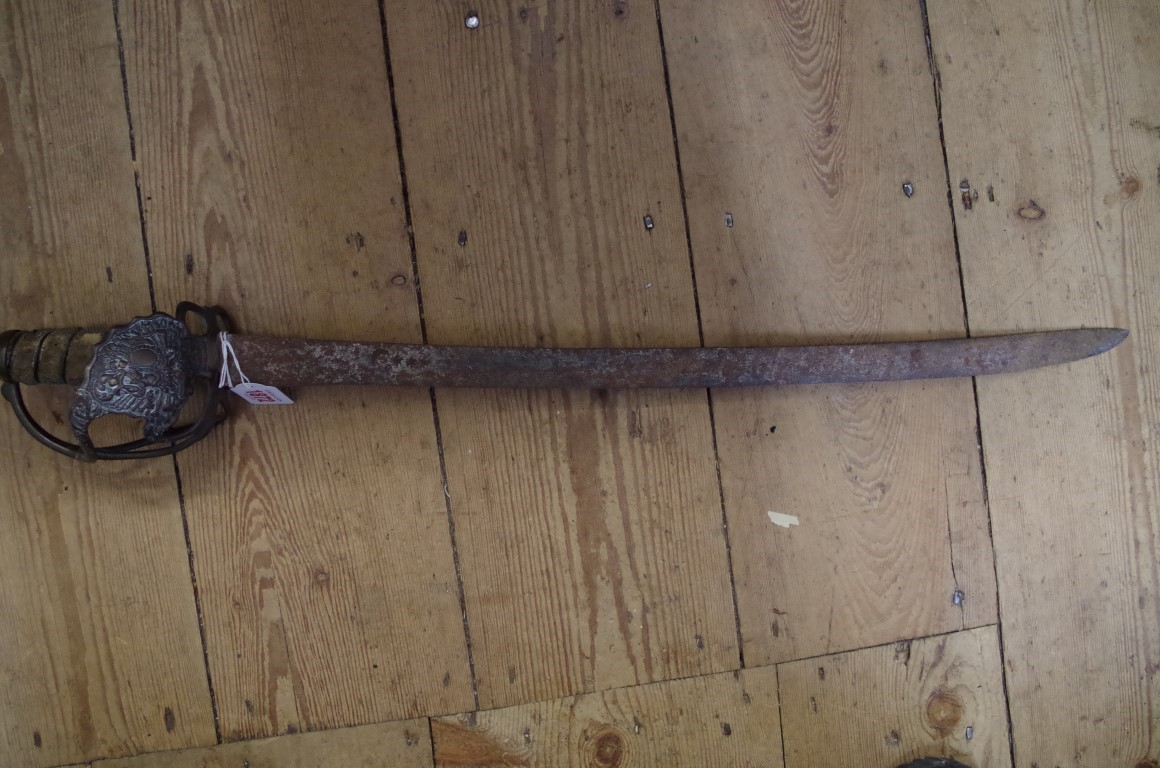 An antique Turkish ottoman basket handled sword, with crescent and three stars to blade, the blade