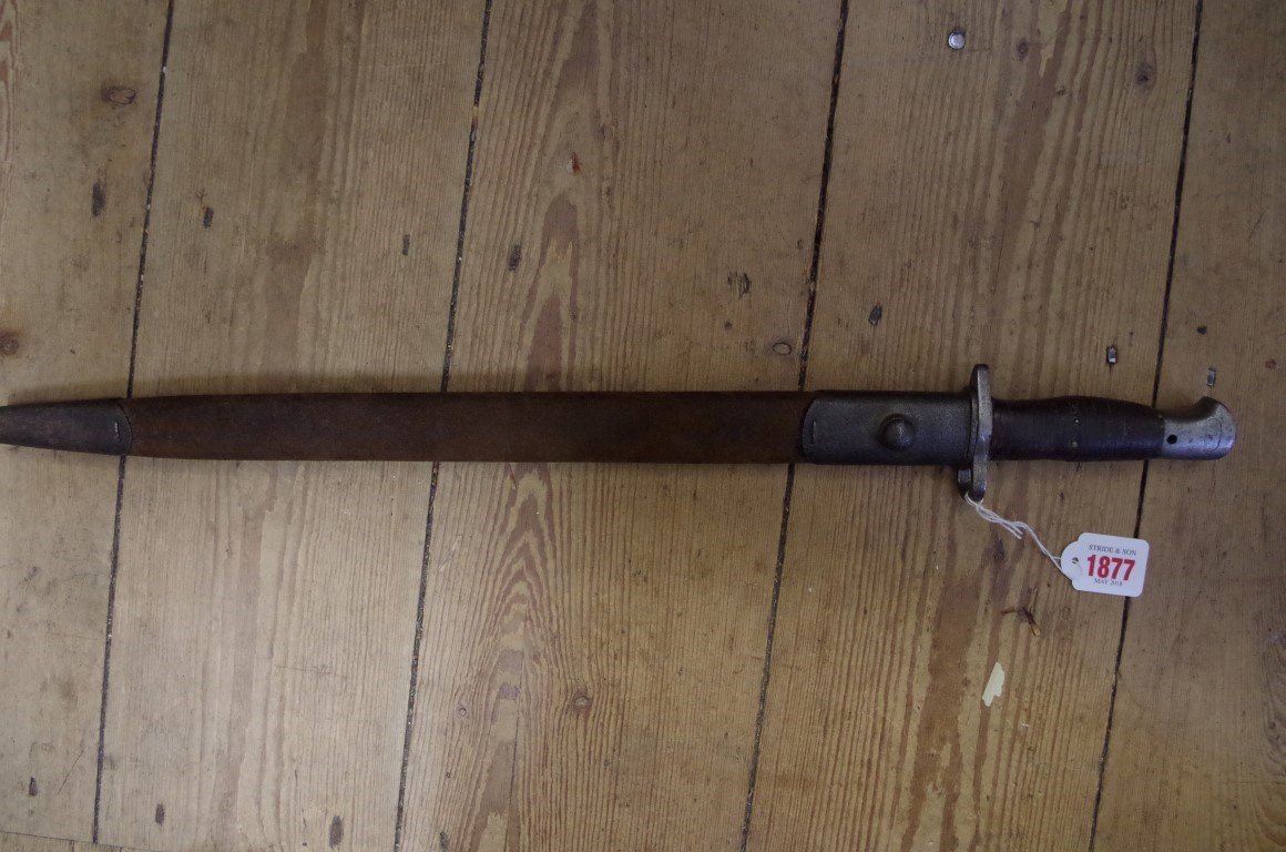 A British SMLE 1907 pattern Sanderson bayonet, having leather handle and leather sheath.