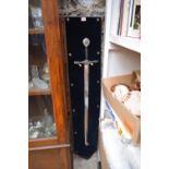 A reproduction crusader style sword, with 78cm blade, and wall mounted plaque stand.