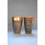 A pair of Eastern metal beakers, 12.5cm.