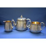 A Victorian silver engine turned three piece tea set, by John Samuel Hunt, London 1860 & 1861,