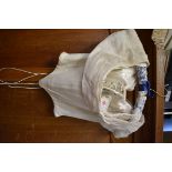 Elizabeth Emanuel: an ivory silk lined and silk chiffon boned corset, with original label, size 12.