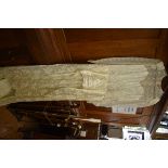 A vintage ivory silk and lace wedding dress.